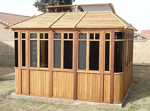 DIY Wood Gazebo (14' L, 12' W, Mature Redwood, Sliding Windows, 4' x 6' Skylight, 24" H Siding Below Windows, Vertical Siding, Japanese Doors, No Flooring, Transparent Premium Sealant). Custom detail: Roof overhang was minimized per customer request.