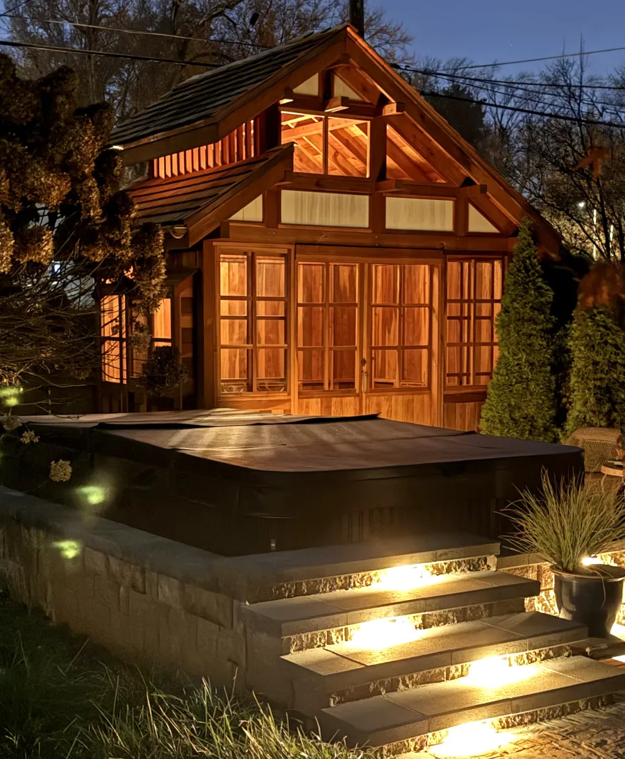 Custom Dream Gazebos (Options: 9 ft Wall Height, 10' L, 14' W, California Redwood, Combination of Sliding Windows with Screens and Fixed Windows, No Skylight, 36" H Siding Below Windows, Vertical Siding, Roof Pitch 8:12, Japanese Doors with Screens, No Floor [Installed on an Existing Deck], Shiplap Roof, Transparent Premium Sealant). Photo Courtesy of J. & R. Griess of Omaha, NE.