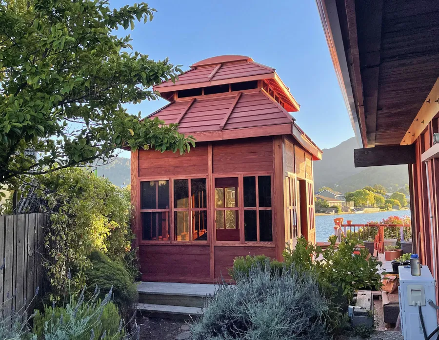 Dream Gazebos (Options: 9 ft Wall Height, 10' L, 14' W, Douglas-fir, All Sliding Windows with Screens, 4' x 6' Skylight, 36" H Siding Below Windows, Horizontal Siding, Japanese Doors with Screens, Complete Floor, Shiplap Roof, Cherry Stain Premium Sealant). Photo Courtesy of B. Victor of Larkspur of California.
