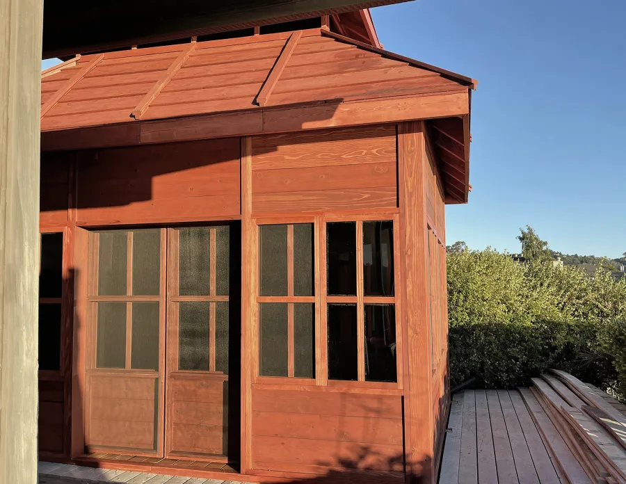 Dream Gazebos (Options: 9 ft Wall Height, 10' L, 14' W, Douglas-fir, All Sliding Windows with Screens, 4' x 6' Skylight, 36" H Siding Below Windows, Horizontal Siding, Japanese Doors with Screens, Complete Floor, Shiplap Roof, Cherry Stain Premium Sealant). Photo Courtesy of B. Victor of Larkspur, California.
