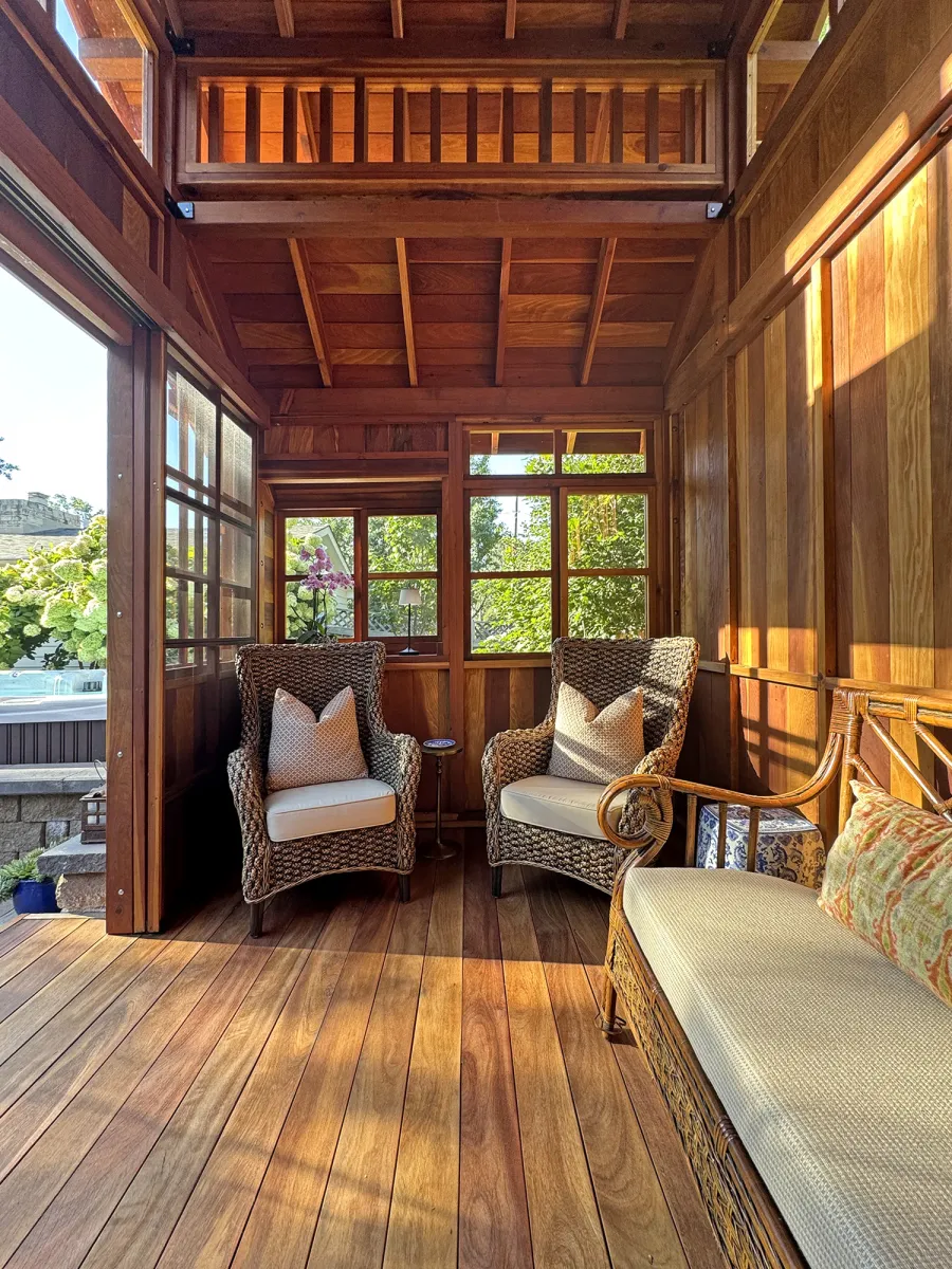 Custom Dream Gazebos (Options: 9 ft Wall Height, 10' L, 14' W, California Redwood, Combination of Sliding Windows with Screens and Fixed Windows, No Skylight, 36" H Siding Below Windows, Vertical Siding, Roof Pitch 8:12, Japanese Doors with Screens, No Floor [Installed on an Existing Deck], Shiplap Roof, Transparent Premium Sealant). Photo Courtesy of J. & R. Griess of Omaha, NE.