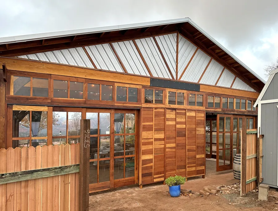 Custom El Paso Wedding Pavilion (Options: 50' L x 45' 6" W, California Redwood, 12' H Posts, 8-Post Anchor Kit for High-Wind, Transparent Premium Sealant). Custom sliding french doors and windows to enclose the structure were added by Forever Redwood during the design process. Photos Courtesy of T. Bruge of The Skyranch Lodge of Sedona, AZ.