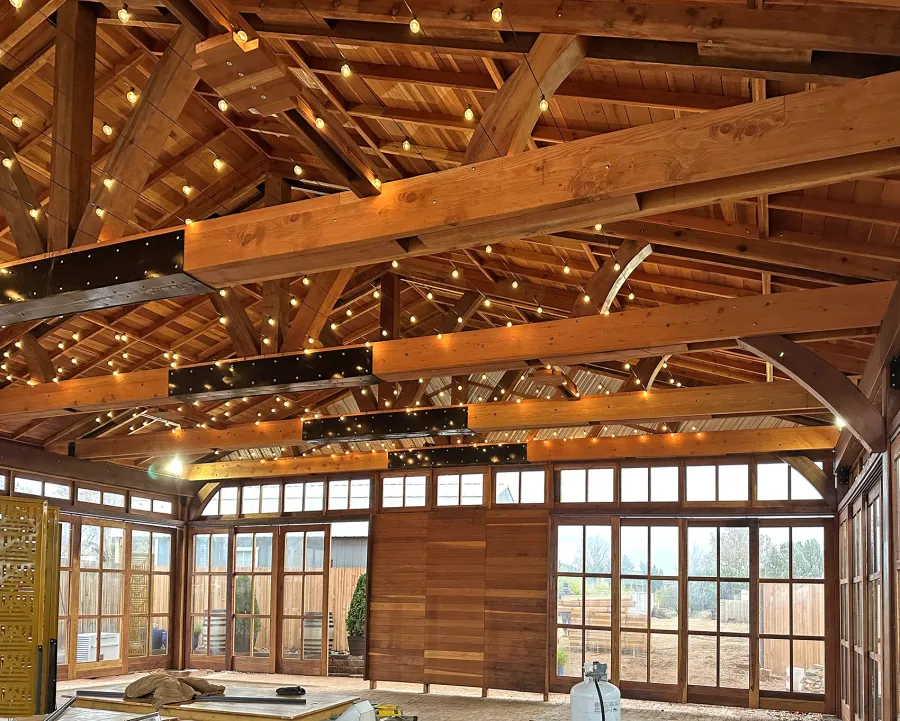 Custom El Paso Wedding Pavilion (Options: 50' L x 45' 6" W, California Redwood, 12' H Posts, 8-Post Anchor Kit for High-Wind, Transparent Premium Sealant). Custom sliding french doors and windows to enclose the structure were added by Forever Redwood during the design process. Photos Courtesy of T. Bruge of The Skyranch Lodge of Sedona, AZ.