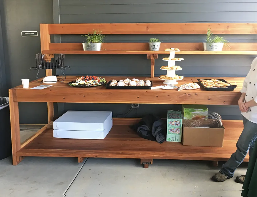 Custom Eli's Redwood Potting Bench (Options: 10' L x 36" W [Custom size], California Redwood, No Casters, One Shelf, No Drawers, No Fold Down Sides, No Engraving, No Lids, Transparent Premium Sealant). Photo Courtesy of B. Shanks of Salem, OR.