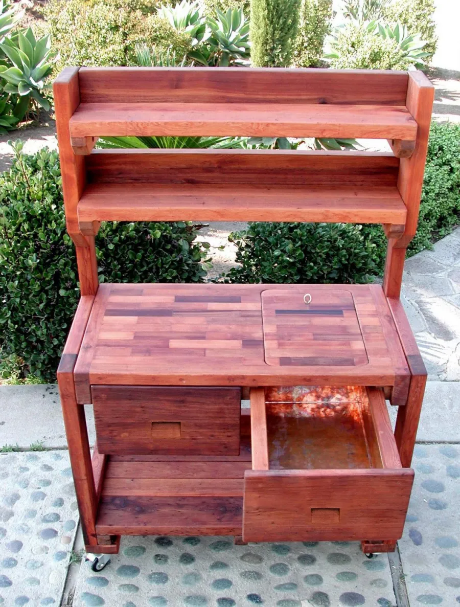 Eli's Redwood Potting Bench (Options: Standard Size, Old-Growth Redwood, Casters, 2 Shelves, Copper Inset for Right Drawer, No Engraving, Removable Lid on Right Side, Transparent Premium Sealant).  Photo shows tabletop lid removed.