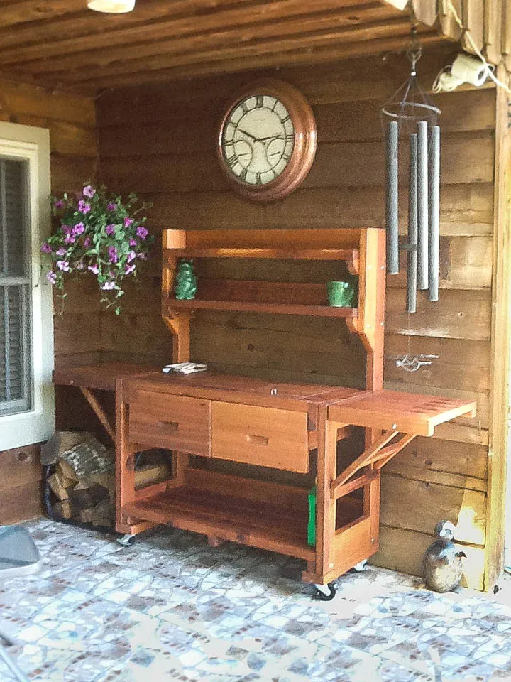 Eli's Redwood Potting Bench (Options: XL Size, Mature Redwood, Casters, 2 Shelves, Both Sides Fold Down, Copper Inset for Both Drawers, No Engraving, Removable Lid Over Right Drawer, Transparent Premium Sealant). Photo Courtesy of Linda Bond of Burkeville, Texas.