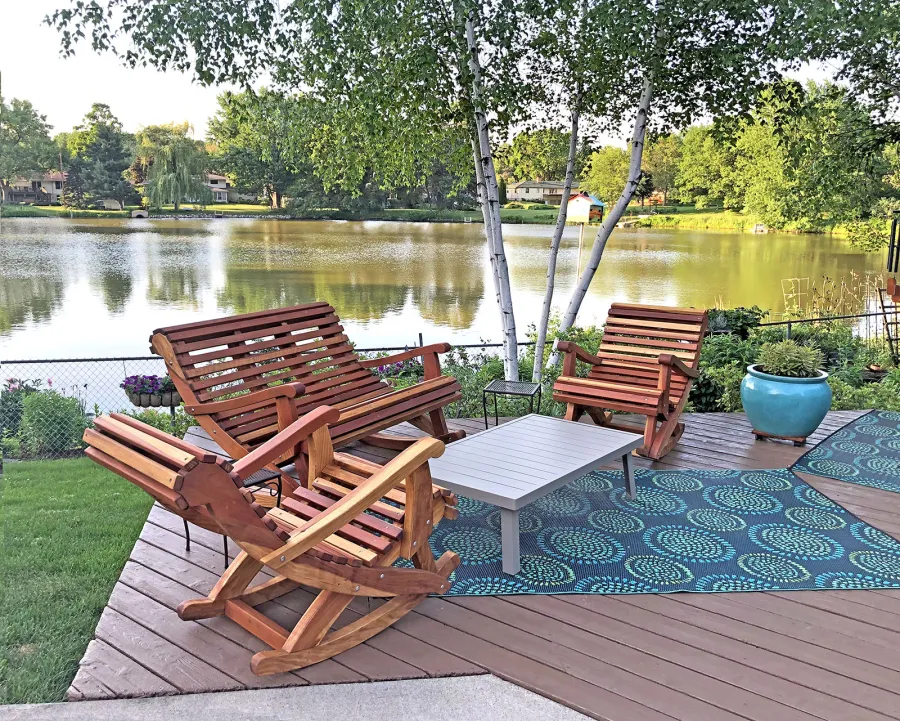 Ensenada Wooden Rocking Chair (Options: Standard Width, California Redwood, No Cushion,Transparent Premium Sealant). Photo Also Shows an Ensenada Rocking Bench. Photo Courtesy of D. Womack of White Bear Lake, Minnesota.