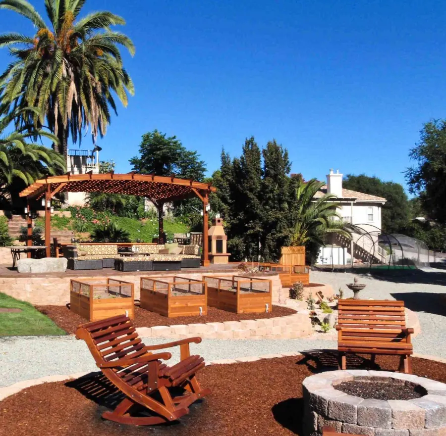Ensenada Wooden Rocking Chair (Options: Extra Wide, California Redwood, No Cushion, Transparent Premium Sealant) and 16' x 20' Arched Pergola. Photo courtesy of Mr. M. Tomacelli of Fallbrook, CA.