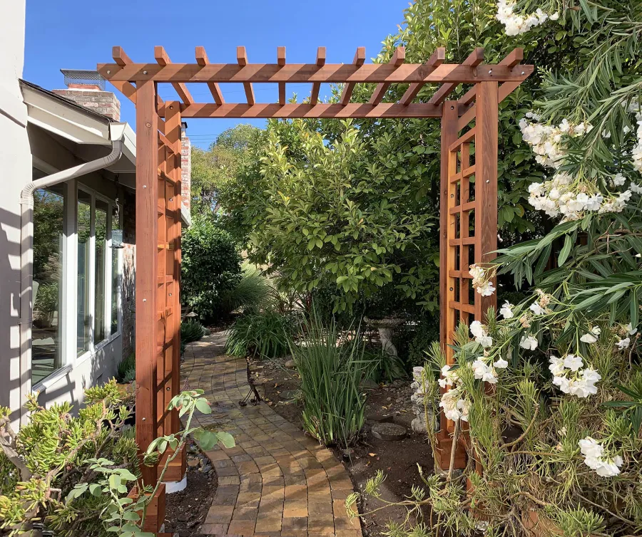 Entryway Arbor (Options: 96" W, 36" D, California Redwood, 4-Post Archor Kit for Concrete, Transparent Premium Sealant). Photo Courtesy of C. Baeuerlen of Los Altos, CA.