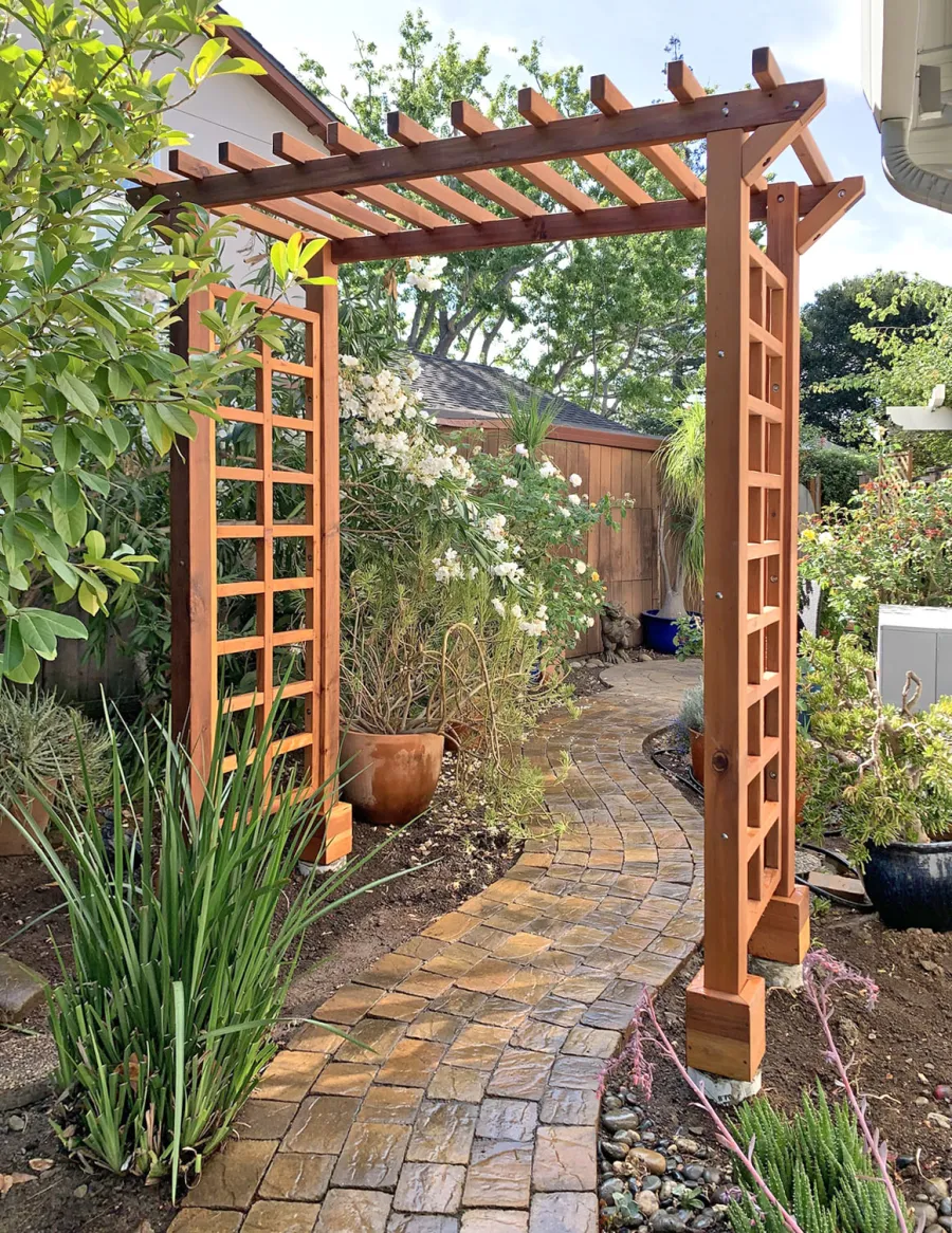 Entryway Arbor (Options: 96" W, 36" D, California Redwood, 4-Post Archor Kit for Concrete, Transparent Premium Sealant). Photo Courtesy of C. Baeuerlen of Los Altos, CA.
