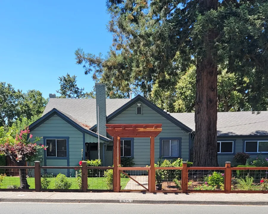 Custom Entryway Arbor (Options: 60" W, 57" D, 12 ft Height, California Redwood, Transparent Premium Sealant). Photo Courtesy of C. Johnson of Santa Rosa, CA.