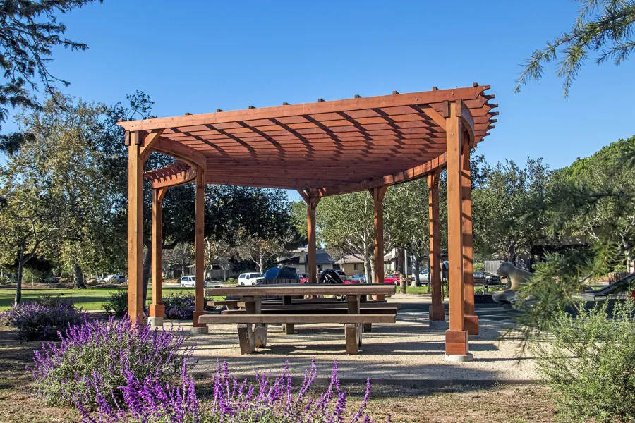 Fan Shaped Pergola Kit (Options: 35' x 16', Mature Redwood, With Roof Slats, No Electrical Wiring Trim Kit, 8-Post Anchor Kit for Concrete, No Ceiling Fan Base, 9.5' Posts, No Curtain Rods, Transparent Premium Sealant). Photo Courtesy of M. Roberts of Carpinteria, California.