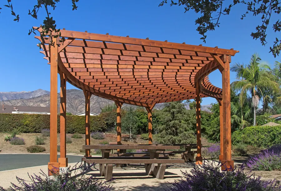 Fan Shaped Pergola Kit (Options: 35' x 16', Mature Redwood, With Roof Slats, No Electrical Wiring Trim Kit, 8-Post Anchor Kit for Concrete, No Ceiling Fan Base, 9.5' Posts, No Curtain Rods, Transparent Premium Sealant). Photo Courtesy of M. Roberts of Carpinteria, California.