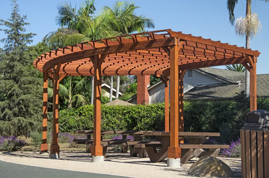 Fan Shaped Pergola Kit (Options: 35' x 16', Mature Redwood, With Roof Slats, No Electrical Wiring Trim Kit, 8-Post Anchor Kit for Concrete, No Ceiling Fan Base, 9.5' Posts, No Curtain Rods, Transparent Premium Sealant). Photo Courtesy of M. Roberts of Carpinteria, California.