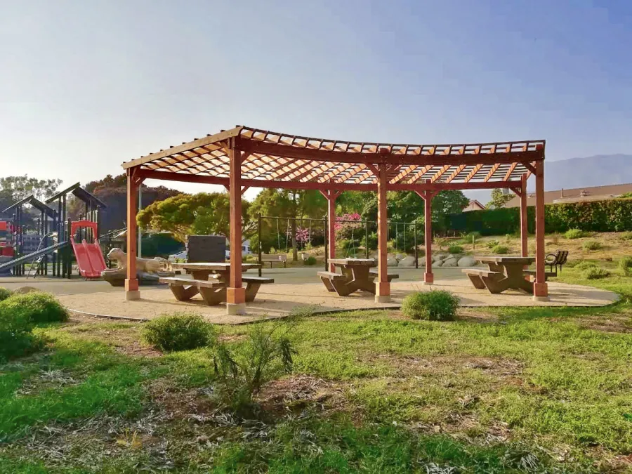Fan Shaped Pergola Kit (Options: 22' x 25', California Redwood, With Roof Slats, No Electrical Wiring Trim Kit, 8-Post Anchor Kit for Concrete, No Ceiling Fan Base, 9.5' Posts, No Curtain Rods, Transparent Premium Sealant). Photo Courtesy of Vedic Education and Devotional Academy of Milpitas, California.