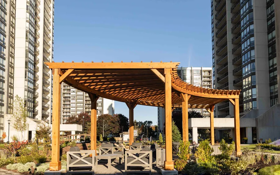 Fan Shaped Pergola Kit (Options: 38' x 14', California Redwood, With Roof Slats, 1 Electrical Wiring Trim Kit, 8-Post Anchor Kit for High-Wind, No Ceiling Fan Base, 10' Posts, No Curtain Rods, Transparent Premium Sealant). Photo Courtesy of A. Finnegan of Toronto, Ontario, Canada. 