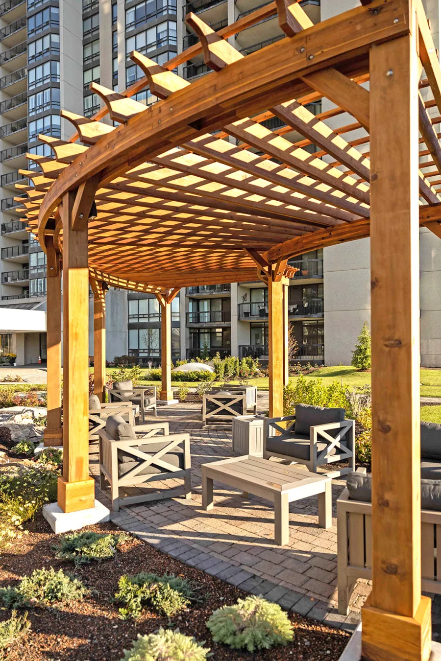 Fan Shaped Pergola Kit (Options: 38' x 14', California Redwood, With Roof Slats, 1 Electrical Wiring Trim Kit, 8-Post Anchor Kit for High-Wind, No Ceiling Fan Base, 10' Posts, No Curtain Rods, Transparent Premium Sealant). Photo Courtesy of A. Finnegan of Toronto, Ontario, Canada. 