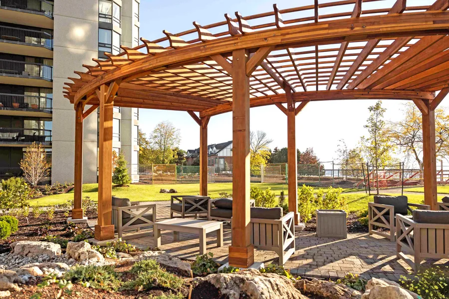 Fan Shaped Pergola Kit (Options: 38' x 14', California Redwood, With Roof Slats, 1 Electrical Wiring Trim Kit, 8-Post Anchor Kit for High-Wind, No Ceiling Fan Base, 10' Posts, No Curtain Rods, Transparent Premium Sealant). Photo Courtesy of A. Finnegan of Toronto, Ontario, Canada. 