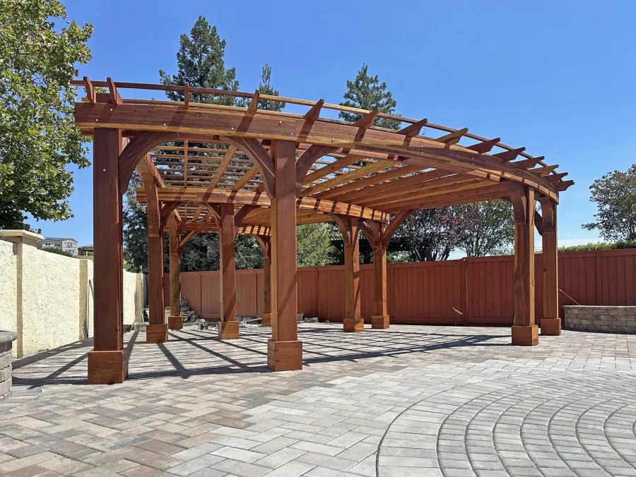 Fan Shaped Pergola Kit (Options: 35' x 16', California Redwood, With Roof Slats, No Electrical Wiring Trim Kit, Post Anchor Kit for High Wind, No Ceiling Fan Base, 10' Posts, No Curtain Rods, Transparent Premium Sealant). Photo Courtesy of R. & M. Gonzalez of Dublin, CA.