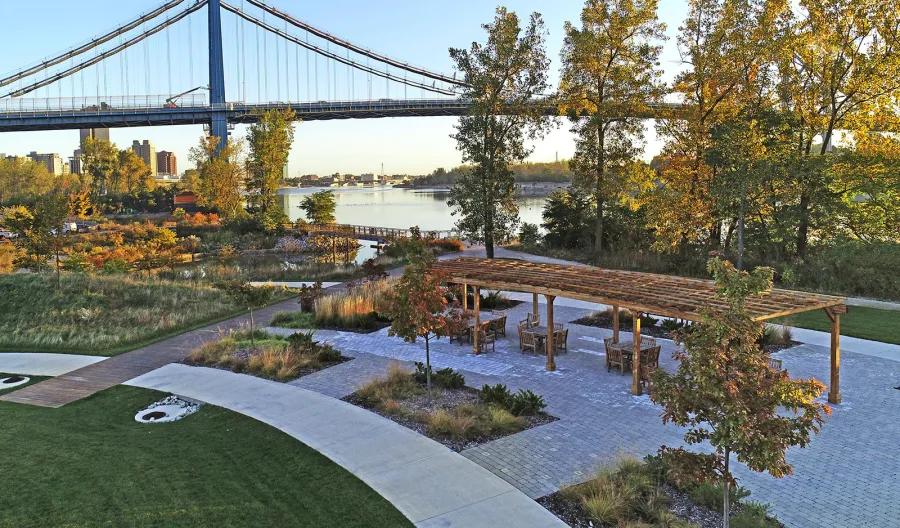 Fan Shaped Pergola Kit (Options: 50' x 14', California Redwood, Roof Slats at 18", No Electrical Wiring Trim Kit, 9-Post Anchor Kit for Concrete, No Ceiling Fan Base, 9.5' Posts, No Curtain Rods, Transparent Premium Sealant). Photo Courtesy of Metroparks Toledo of Toledo, OH.