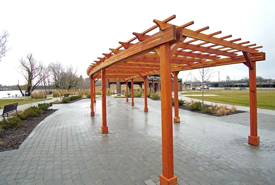 Fan Shaped Pergola Kit (Options: 50' x 14', California Redwood, Roof Slats at 18", No Electrical Wiring Trim Kit, 9-Post Anchor Kit for Concrete, No Ceiling Fan Base, 9.5' Posts, No Curtain Rods, Transparent Premium Sealant). Photo Courtesy of Metroparks Toledo of Toledo, OH.