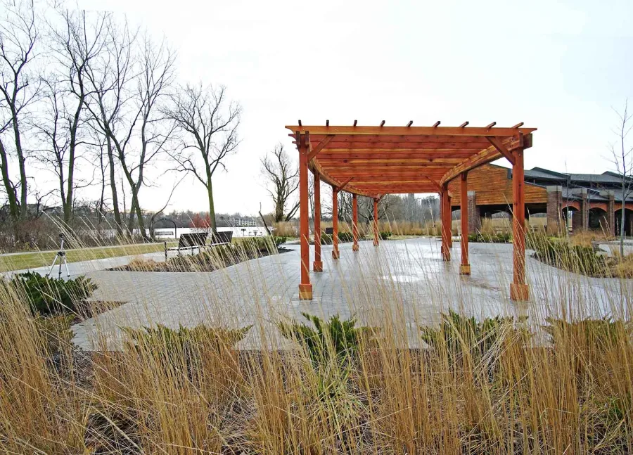 Fan Shaped Pergola Kit (Options: 50' x 14', California Redwood, Roof Slats at 18", No Electrical Wiring Trim Kit, 9-Post Anchor Kit for Concrete, No Ceiling Fan Base, 9.5' Posts, No Curtain Rods, Transparent Premium Sealant). Photo Courtesy of Metroparks Toledo of Toledo, OH.