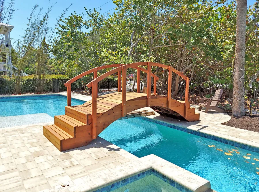 Custom Forever Foot Bridge (Options: 12' L, California Redwood, 5' Wide Instead of the Standard 4' Width, with Custom Steps, Transparent Premium Sealant). Photo Courtesy of A. Roe of Boca Grande, Florida.