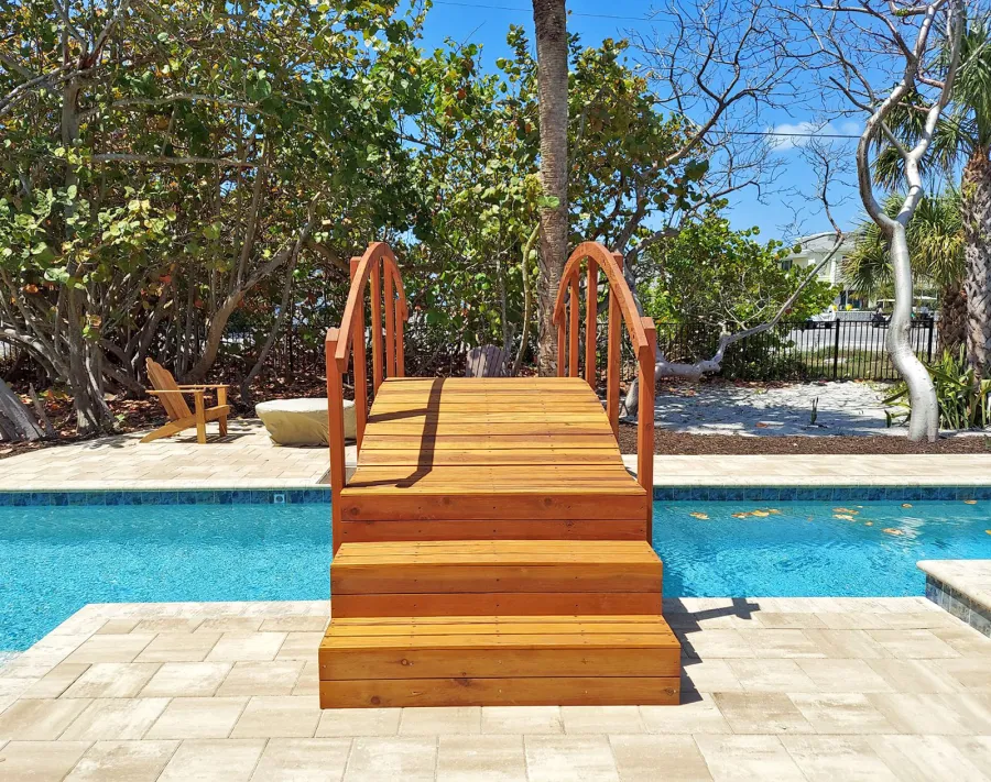 Custom Forever Foot Bridge (Options: 12' L, California Redwood, 5' Wide Instead of the Standard 4' Width, with Custom Steps, Transparent Premium Sealant). Photo Courtesy of A. Roe of Boca Grande, Florida.