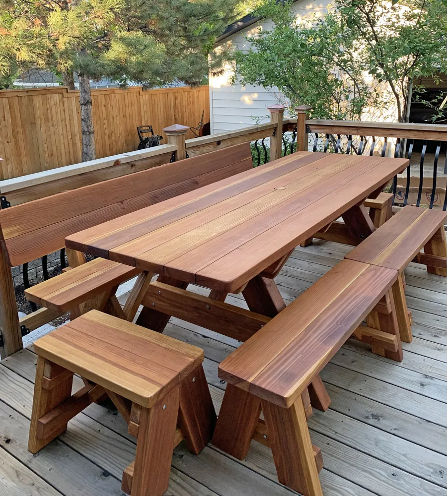 Forever Picnic Tables (Unattached Benches)  (Options: 7' L, 34 ½in W, Side and End Benches, California Redwood, 1 Full Length Fullback Bench on One Side, and 2 Half Length Picnic Benches on the Other Side, Standard Tabletop, Squared Corners, 2in Diameter Umbrella Hole, Transparent Premium Sealant). Photo Courtesy of I. Miller of Longmont, Colorado.