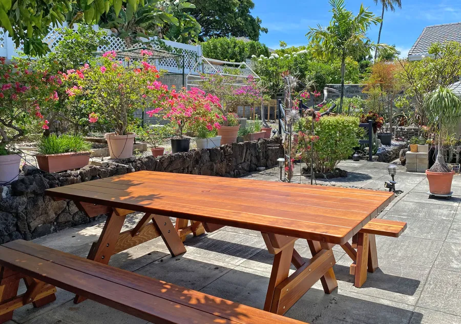 Forever Picnic Table (Unattached Benches) (Options: 8' L, 40 ¼in W, Side Benches, California Redwood, 1 Full Length Bench Per Side, Standard Tabletop, Slightly Rounded Corners, 2in Diameter Umbrella Hole, Transparent Premium Sealant). Photo Courtesy of L. Nakmura of Honolulu, Hawaii. 