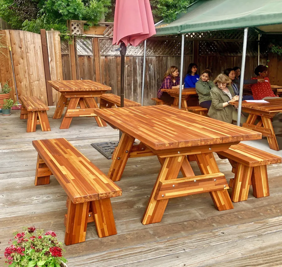 Forever Picnic Tables (Unattached Benches) (Options: Custom Size, 4' L, 29 ½in W, 26in H, Side Benches, Mosaic Redwood, 1 Full Length Side Benches Per Side, Forever Style Benches, Standard Tabletop [Leg Flair Recessed], Rounded Corners, No Umbrella Hole, Transparent Premium Sealant). Photo Courtesy of M. Gaston of Menlo Park, CA.