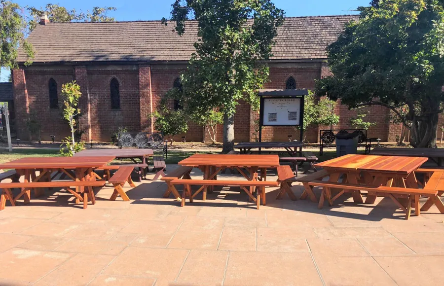 Custom Forever Picnic Tables (Unattached Benches) (Options: 6' L, 28 ¾in W, California Redwood, 1 Full Length Bench Per Side, Standard Tabletop, Slightly Rounded Corners, No Umbrella Hole, Transparent Premium). Tables Placed Together to Create a Square Table. Photo Courtesy of M. Sutton of San Marino, California.