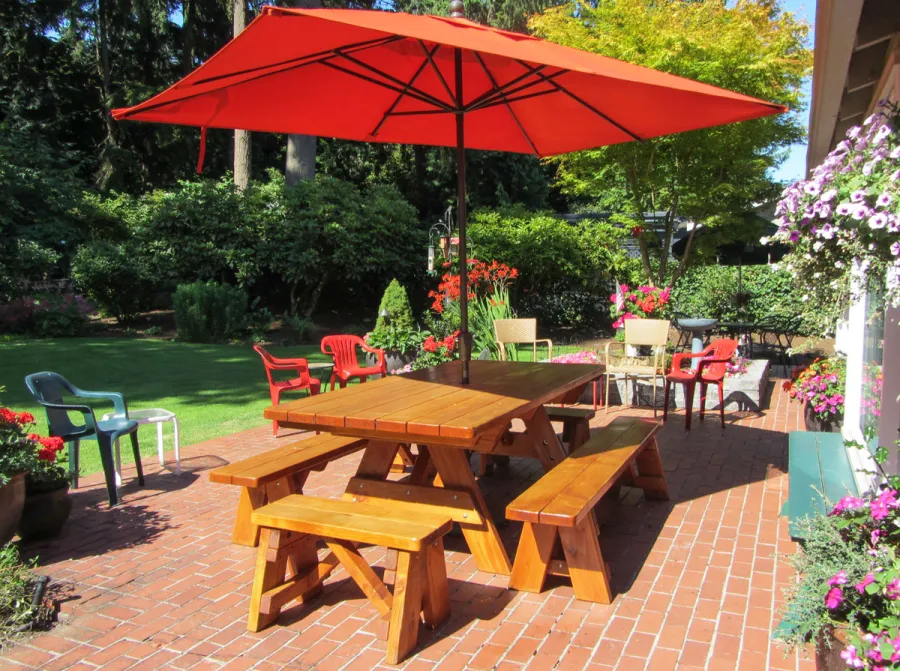 Forever Picnic Tables (Unattached Benches) (Options: 7' L, 40 ¼in W, Side and End Benches, Douglas-fir, 1 Full Length Side Bench Per Side, Standard Tabletop, Rounded Corners, Umbrella Hole [Umbrella not Included], Adjusted Leg Flair, Transparent Sealant). Photo Courtesy of Barbara A. Crawford of Mercer Island, Washington.