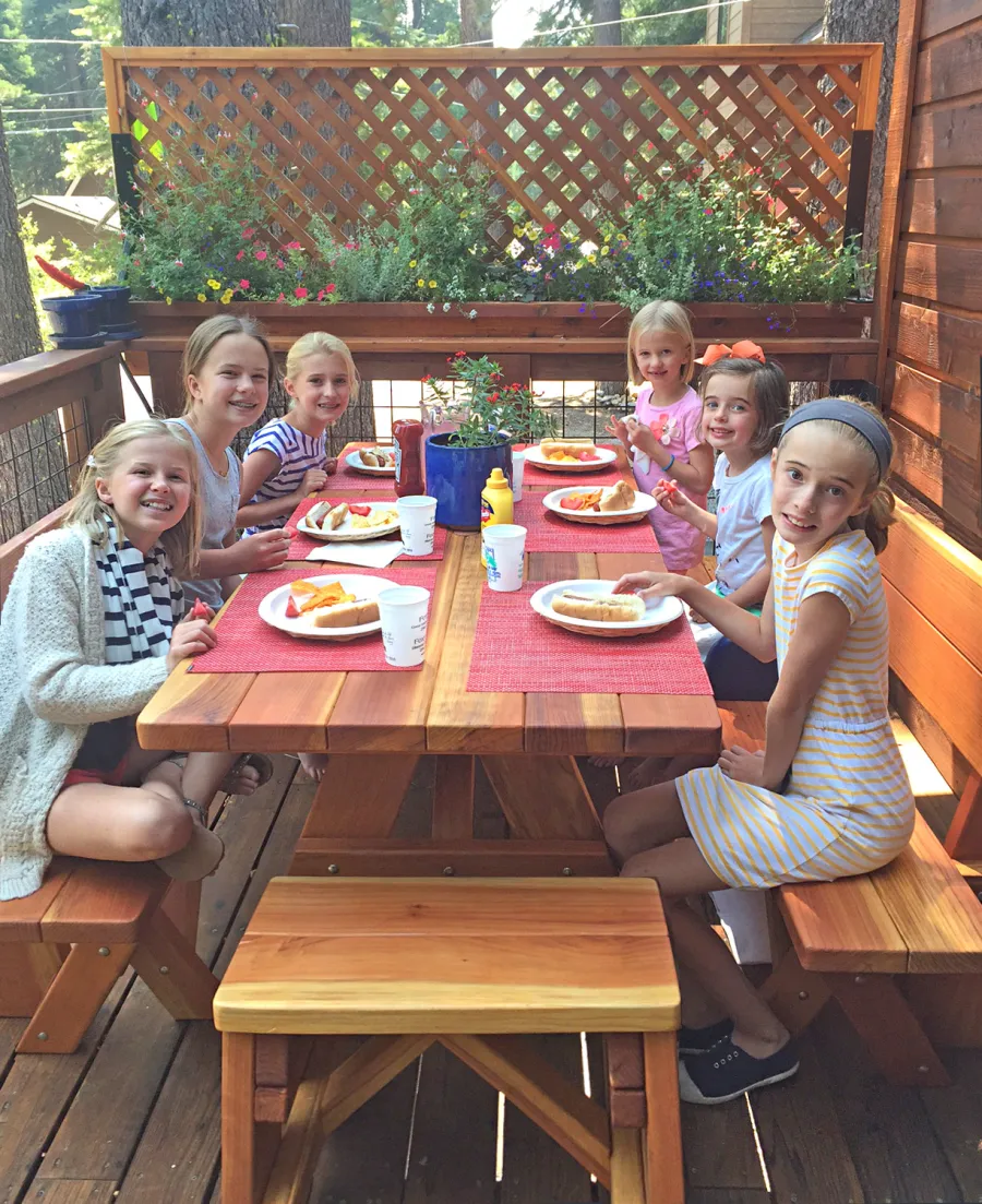 Forever Picnic Tables (Unattached Benches) (Options: 6' L, 34 ½in W, Fullback Side Benches & Backless End Benches, California Redwood, 1 Full Length Side Benches Per Side, Standard Tabletop, Slightly Rounded Corners, 1 5/8in Diameter Umbrella Hole, Transparent Premium Sealant, Leg Flair Reduced from 47" Width at Base to Width of Tabletop). Photo Courtesy of M. Lyons of Tahoma, CA.