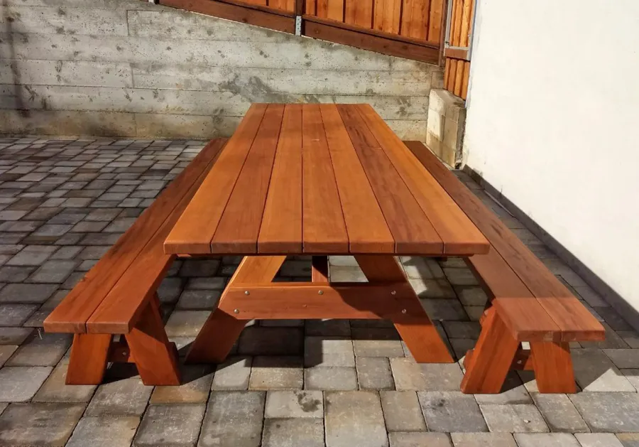 Forever Picnic Tables (Unattached Benches) (Options: 10' L, 40 ¼in W, Side Benches, Mature Redwood, 1 Full Length Bench Per Side, Standard Tabletop, Squared Corners, 1 5/8in Umbrella Hole, Transparent Premium Sealant). Photo Courtesy of R. Miller of Millbrae, CA.