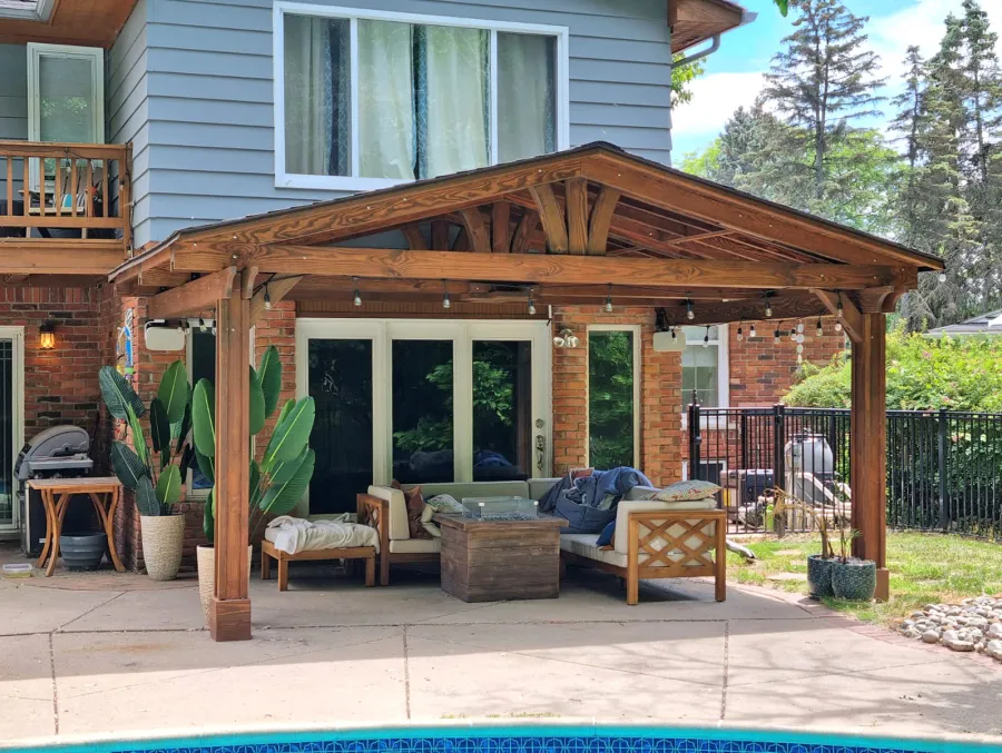 Forever Porch Pavilion (Options: 18' L x 12' W, Douglas-fir, 2-Post Anchor Kit for High-Wind, No Electrical Wiring Trim, 8.5 ft Posts Height, Vertical Post Decorative Trims, No Ceiling Fan Base, No Curtain Rods, No Privacy Panels, Transparent Premium Sealant). Photo Courtesy of C. Mellanby of West Bloomfield, Michigan.