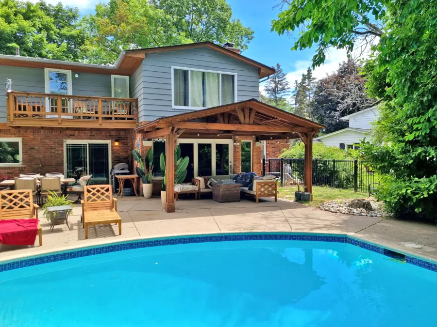 Forever Porch Pavilion (Options: 18' L x 12' W, Douglas-fir, 2-Post Anchor Kit for High-Wind, No Electrical Wiring Trim, 8.5 ft Posts Height, Vertical Post Decorative Trims, No Ceiling Fan Base, No Curtain Rods, No Privacy Panels, Transparent Premium Sealant). Photo Courtesy of C. Mellanby of West Bloomfield, Michigan.