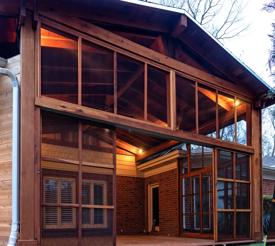 Forever Porch Pavilion (Options: 20' L x 20'-9" W, California Redwood, 2-Post Anchor Kit for High-Wind, No Electrical Wiring Trim, with 2 Fascia Boards for Gutters, 12 ft Posts Height, No Post Decorative Trims, 1 Ceiling Fan Base, No Curtain Rods, with Privacy Panels, Screened Sliding Doors and Fixed Screen Panels, Transparent Premium Sealant). Photo Courtesy of J. Pegg of Cordova, TN.