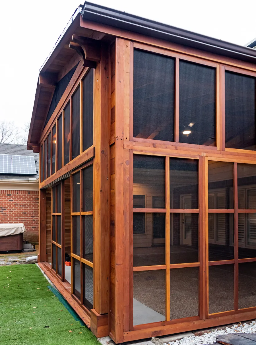 Forever Porch Pavilion (Options: 20' L x 20'-9" W, California Redwood, 2-Post Anchor Kit for High-Wind, No Electrical Wiring Trim, with 2 Fascia Boards for Gutters, 12 ft Posts Height, No Post Decorative Trims, 1 Ceiling Fan Base, No Curtain Rods, with Privacy Panels, Screened Sliding Doors and Fixed Screen Panels, Transparent Premium Sealant). Photo Courtesy of J. Pegg of Cordova, TN.
