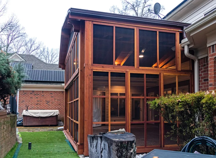 Forever Porch Pavilion (Options: 20' L x 20'-9" W, California Redwood, 2-Post Anchor Kit for High-Wind, No Electrical Wiring Trim, with 2 Fascia Boards for Gutters, 12 ft Posts Height, No Post Decorative Trims, 1 Ceiling Fan Base, No Curtain Rods, with Privacy Panels, Screened Sliding Doors and Fixed Screen Panels, Transparent Premium Sealant). Photo Courtesy of J. Pegg of Cordova, TN.