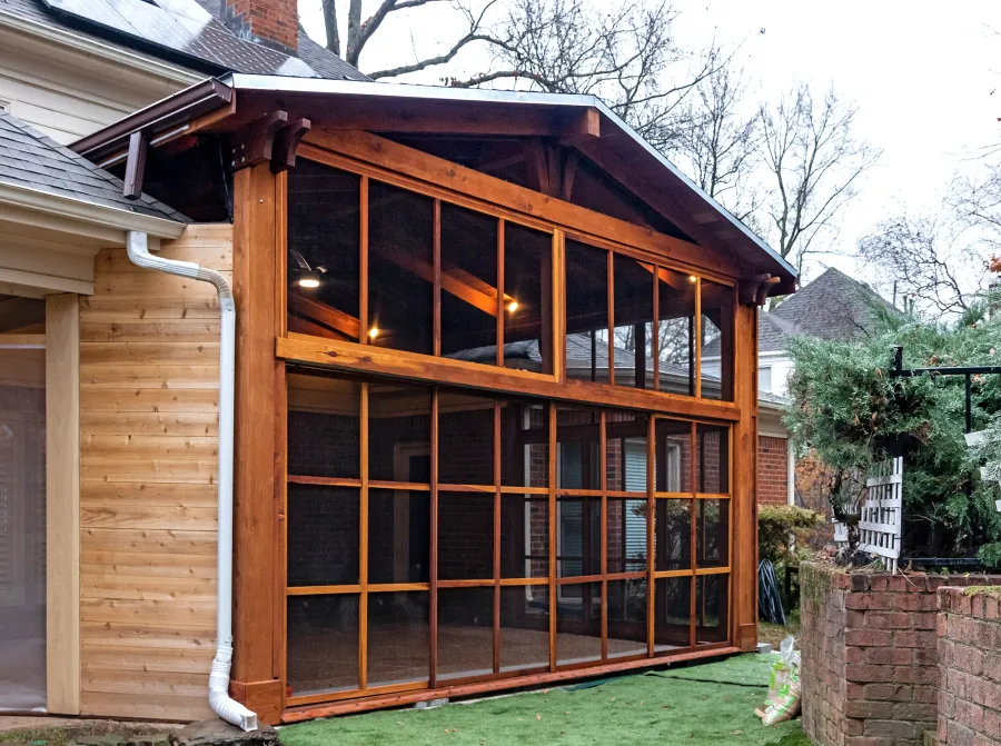 Forever Porch Pavilion (Options: 20' L x 20'-9" W, California Redwood, 2-Post Anchor Kit for High-Wind, No Electrical Wiring Trim, with 2 Fascia Boards for Gutters, 12 ft Posts Height, No Post Decorative Trims, 1 Ceiling Fan Base, No Curtain Rods, with Privacy Panels, Screened Sliding Doors and Fixed Screen Panels, Transparent Premium Sealant). Photo Courtesy of J. Pegg of Cordova, TN.