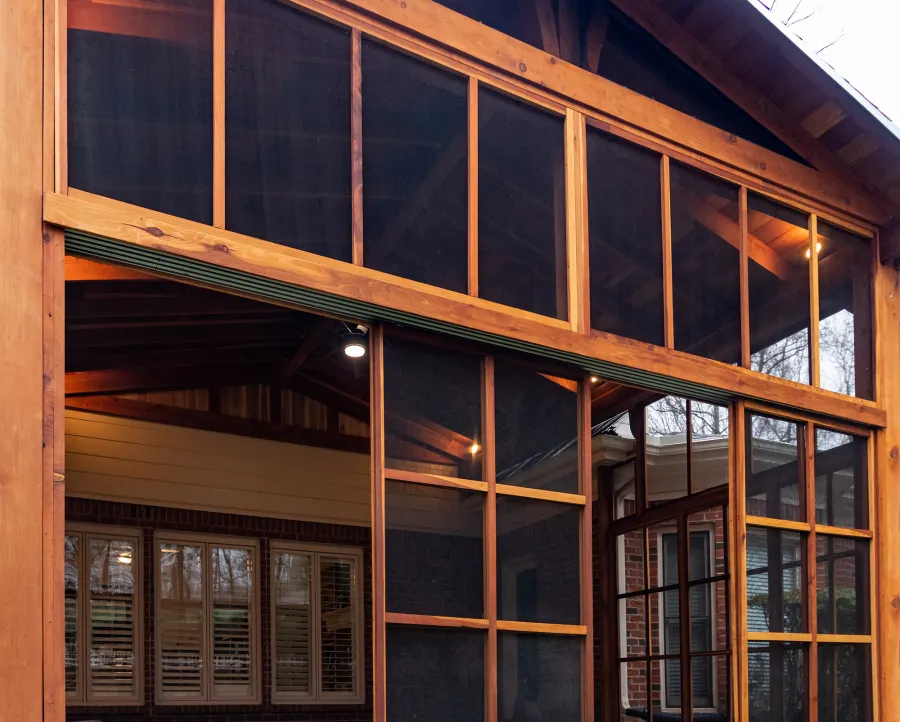 Forever Porch Pavilion (Options: 20' L x 20'-9" W, California Redwood, 2-Post Anchor Kit for High-Wind, No Electrical Wiring Trim, with 2 Fascia Boards for Gutters, 12 ft Posts Height, No Post Decorative Trims, 1 Ceiling Fan Base, No Curtain Rods, with Privacy Panels, Screened Sliding Doors and Fixed Screen Panels, Transparent Premium Sealant). Photo Courtesy of J. Pegg of Cordova, TN.