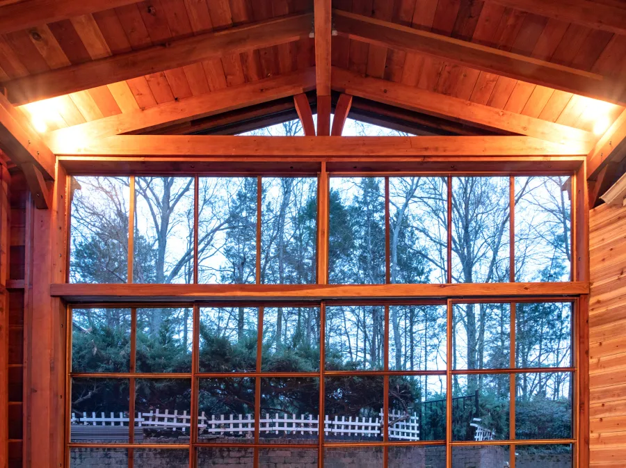 Forever Porch Pavilion (Options: 20' L x 20'-9" W, California Redwood, 2-Post Anchor Kit for High-Wind, No Electrical Wiring Trim, with 2 Fascia Boards for Gutters, 12 ft Posts Height, No Post Decorative Trims, 1 Ceiling Fan Base, No Curtain Rods, with Privacy Panels, Screened Sliding Doors and Fixed Screen Panels, Transparent Premium Sealant). Photo Courtesy of J. Pegg of Cordova, TN.