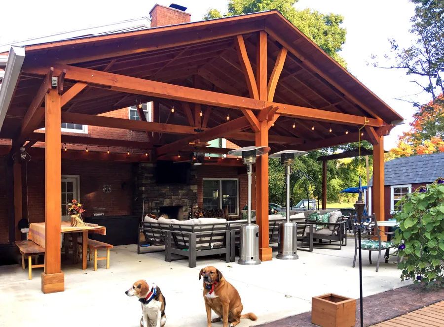 Custom Forever Porch Pavilion (Options: 30' L x 22' W, Douglas-fir, 5-Post Anchor Kit for Concrete, 1 Ceiling Fan Base, Transparent Premium Sealant). Because of the depth of the pavilion, posts up against the house were used for structural reasons. Photo Courtesy of A. Offutt of New Albany, Indiana.