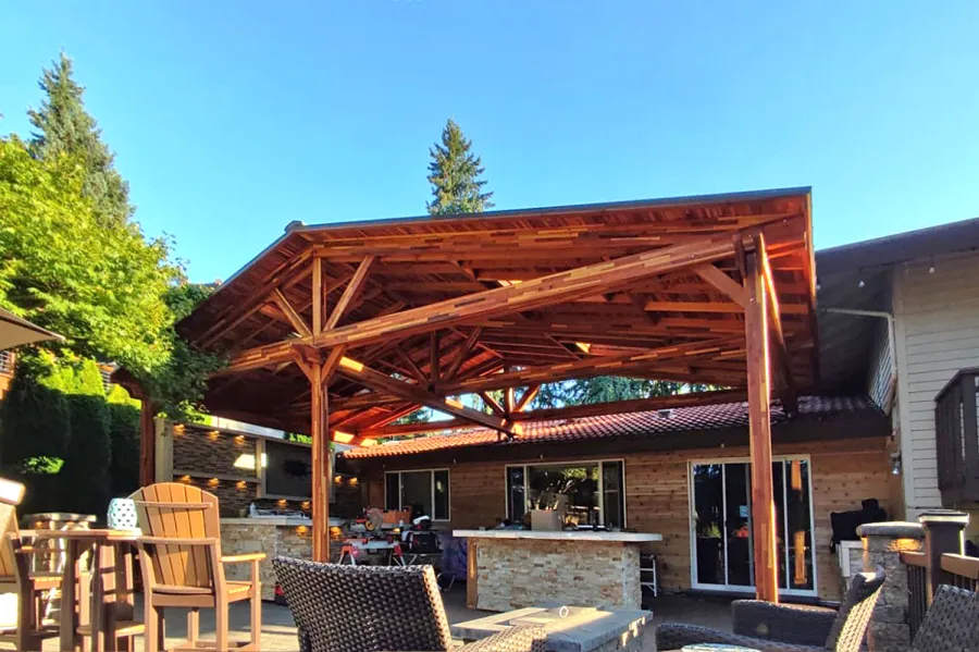 Forever Porch Pavilion (Options: 32'-4" L x 17'-10" W, Mosaic Redwood, 3-Post Anchor Kit for High-Wind, No Electrical Wiring Trim, 11ft Posts Height, No Ceiling Fan Base, No Curtain Rods, No Privacy Panels, Transparent Premium Sealant). Attached to Home Via Roof Risers. Photo Courtesy of S. Tomala of Federal Way, WA.