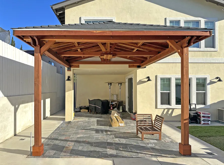 Custom Forever Porch Pavilion (Options: Hip Roof by Custom Request, 15' L x 15' W, California Redwood, 2-Post Anchor Kit for High-Wind, No Electrical Wiring Trim, 10.5ft Posts Height, 1 Ceiling Fan Base, No Curtain Rods, No Privacy Panels, Transparent Premium Sealant). Photo Courtesy of W. Zhang of Thousand Oaks, CA.