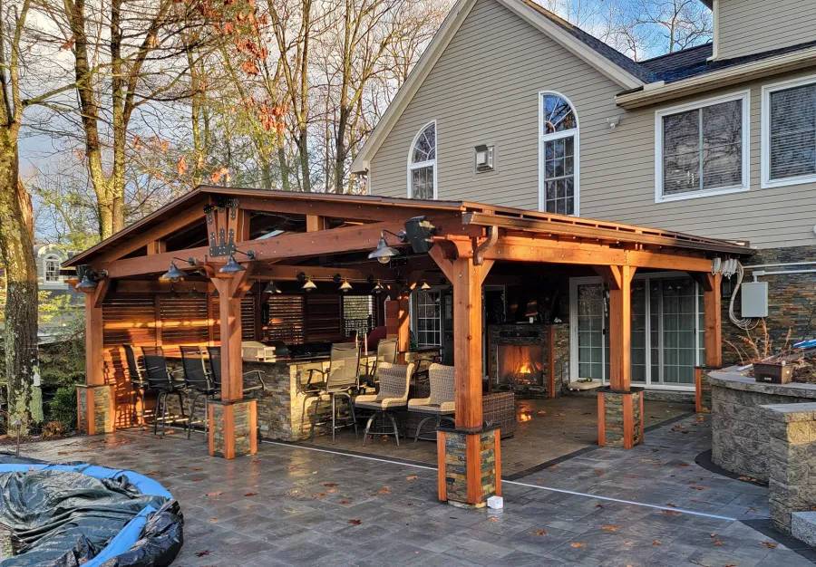 Forever Porch Pavilion (Options: 25'-6" L x 26' W, California Redwood, 8-Post Anchor Kit for High-Wind, No Electrical Wiring Trim, 8.5 ft Posts Height, 1 Privacy Wall with Mobile Louvers, No Post Decorative Trims, No Ceiling Fan Base, No Curtain Rods, Transparent Premium Sealant). Photo Courtesy of R. Robinson of Windham, NH.