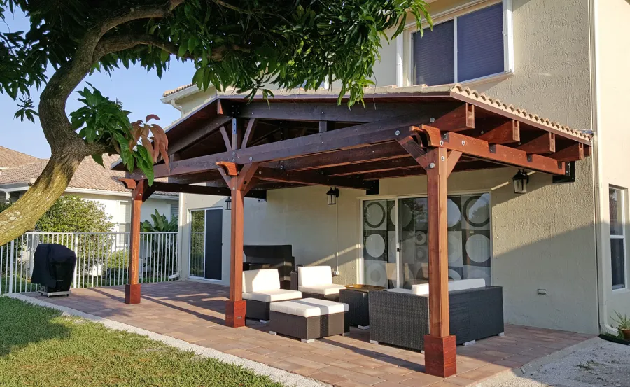Forever Porch Pavilion (Options: 12' L x 25' W, California Redwood, 3-Post Anchor Kit for High-Wind, No Electrical Wiring Trim, 9ft Posts Height, No Ceiling Fan Base, No Curtain Rods, No Privacy Panels, Transparent Premium Sealant). Photo Courtesy of Carol Varela of Florida.