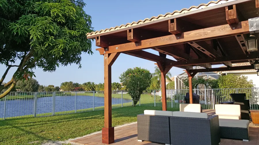 Forever Porch Pavilion (Options: 12' L x 25' W, California Redwood, 3-Post Anchor Kit for High-Wind, No Electrical Wiring Trim, 9ft Posts Height, No Ceiling Fan Base, No Curtain Rods, No Privacy Panels, Transparent Premium Sealant). Photo Courtesy of Carol Varela of Florida.