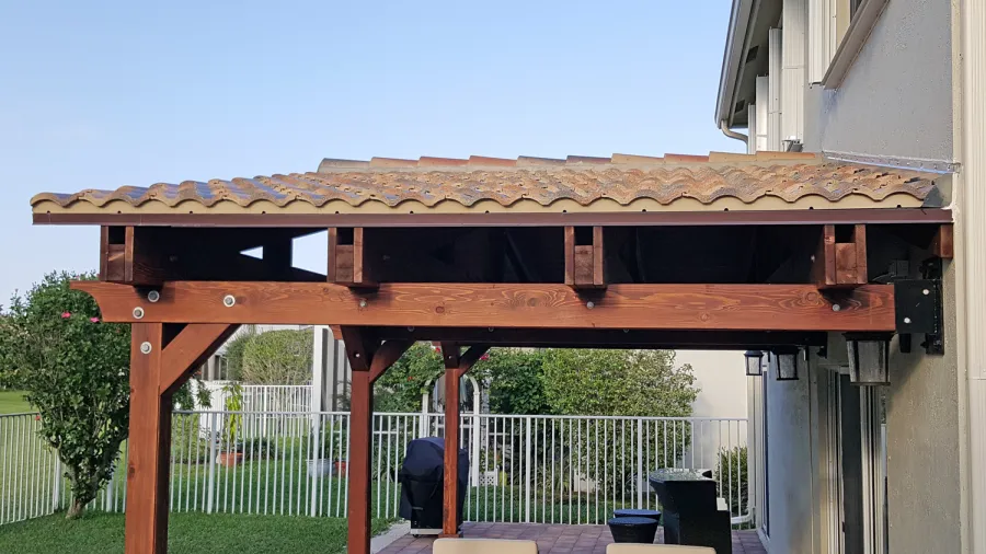 Forever Porch Pavilion (Options: 12' L x 25' W, California Redwood, 3-Post Anchor Kit for High-Wind, No Electrical Wiring Trim, 9ft Posts Height, No Ceiling Fan Base, No Curtain Rods, No Privacy Panels, Transparent Premium Sealant). Photo Courtesy of Carol Varela of Florida.